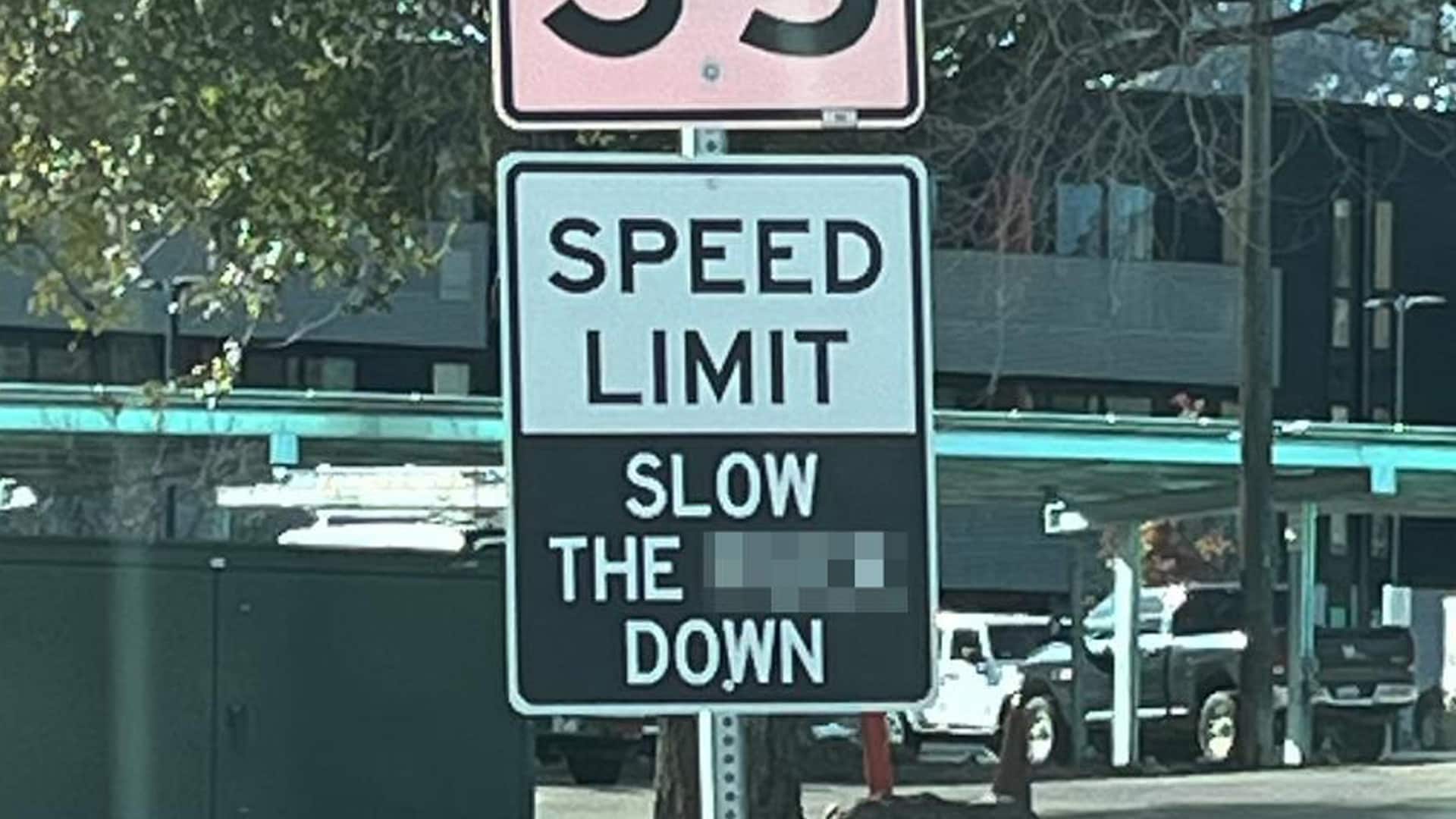 slow the f down traffic sign